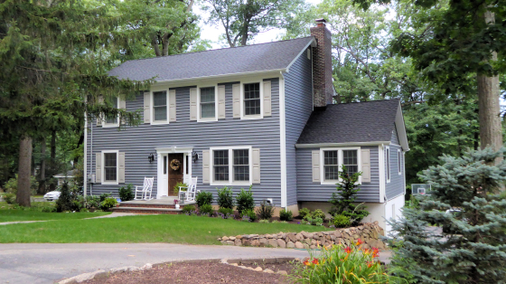 The owners of this lovely home, located in Verona, New Jersey, wanted to add on a second floor and open up the existing first floor to gain more living space. The photos depict the original home and the end result. The budget was tight but in working with the general contractor we were able to create all the rooms they desired while staying within budget. The area to the right side of the house is their existing kitchen which they wanted to maintain but open up to the main body of their home and create a more open plan. The original house had the master bedroom suite nestled tightly into the attic with a narrow stair to access. We expanded out the front of the home (only 235 square foot addition at front) and added a second floor that was approximately 1,000 square feet in which we fit a master bedroom, walk-in closet, master bath along with two additional bedrooms, hall bath and a laundry room.