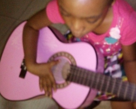 5yr old ifejesu on the guitar
