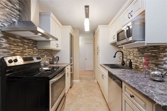 This kitchen was dark and dingy before, but has been transformed into a bright, organized, efficient and beautiful workspace.