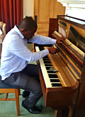 Regulating the action to improve the touch. This makes the piano more responsive to soft gentle play without the need to press hard. This gives the pianist more control.