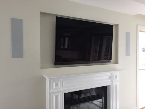 In Wall Speakers And Mounted TV. 