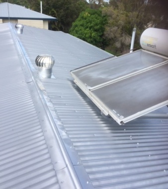 After photo. Renovate with DIAMOND has painted this roof with Silver Frost