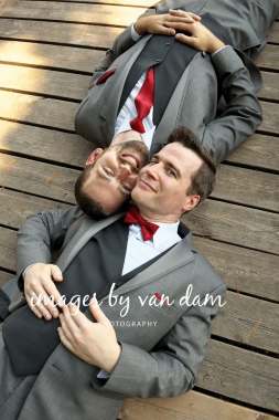 Two grooms lying head to head on dock