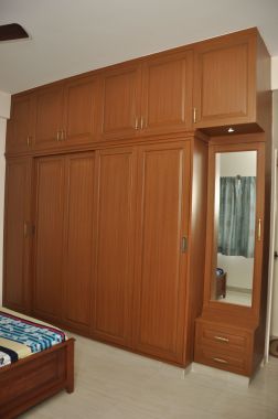 Traditional Wardrobe with Teak veneer shutter finish