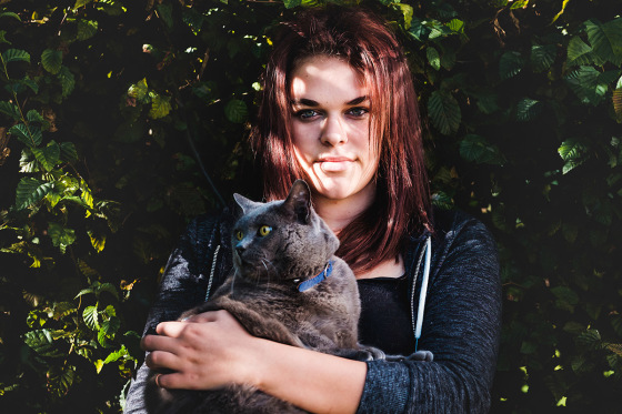 Portrait with cat in the garden