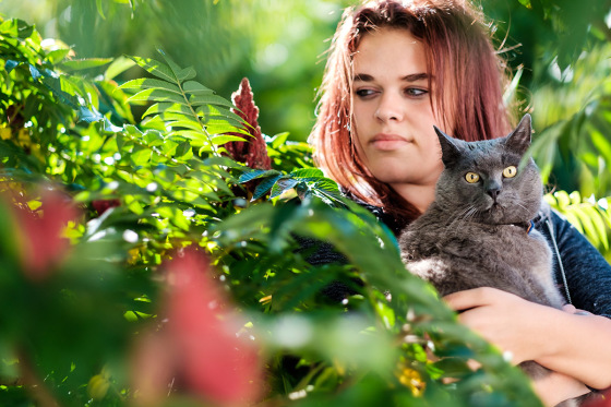 Portrait with cat in the garden