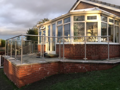 Stainless steel railings with glass panels that make the most of that view