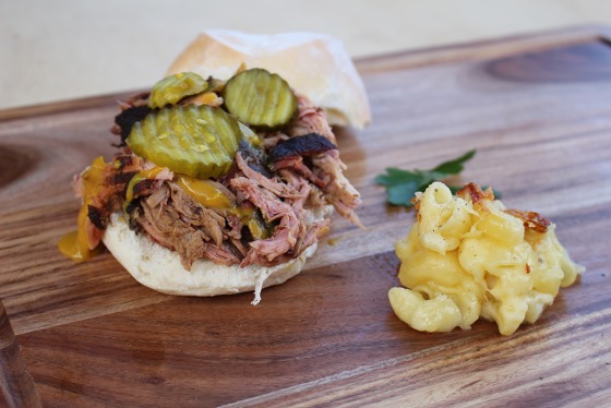 10-Hour Ironbark Smoked Pulled Pork with homemade BBQ sauce & pickles on a bun with a side of Southern Mac n' Cheese