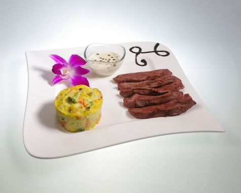 Magret de canard sauce poivre et flan de légumes