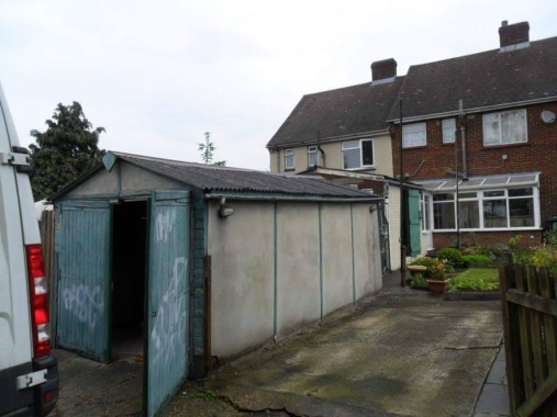 An Asbestos garage, both the roof and side panels are both Asbestos 