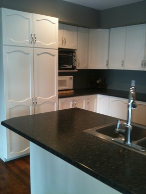 After, As well as painting the cupboards I arranged for and helped the customer choose countertops